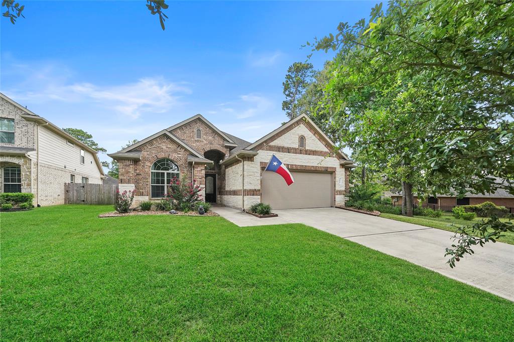 WOW! Stunning open concept 4-bedroom 2017 custom one story home situated on a cul-de-sac in the sought-after Walden on Lake Conroe and Walden Golf Club community. As you enter your front door the entry way brings so much charm with the wood floors, high ceilings and crown molding. This prestigious home is a great split floor plan. All appliances are 4 months old and are black stainless steel to keep away those pesky fingerprints. Kitchen is huge with ample number of cabinets, under cabinet lighting, pantry, breakfast bar and dining area. Living room offers high ceilings, crown molding and a wood burning fireplace. Entire interior of home has recently been painted and looks like brand new. You DO NOT want to miss this oversized garage with a brand-new Trane split A/C system and wired for your entertainment. Large yard has beautiful landscaping and sprinkler system front and back.  In the backyard you will find a covered patio and plenty of room to entertain your guest. MISD