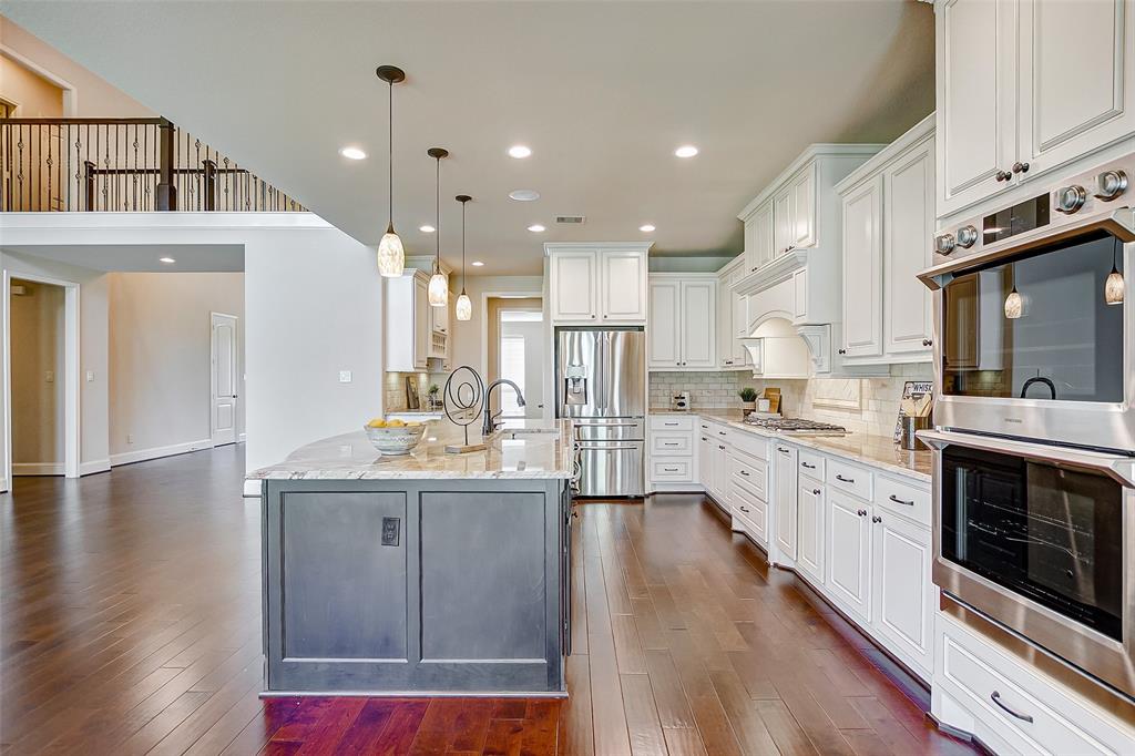 Great view of the kitchen! Top of the line stainless steel appliances. The double oven is the chef's dream.