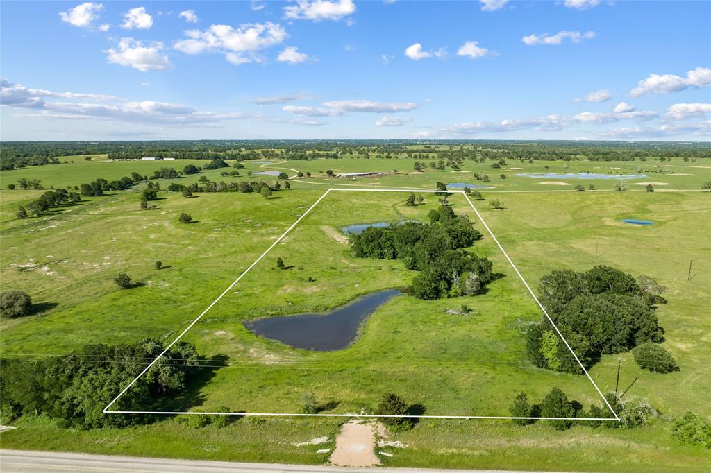 Welcome to GALL Ranch Subdivision of Lee County! Located in the historic area of Serbin, just minutes from Giddings and 50 miles east of Austin, these 12.18 GORGEOUS ACRES serve as a peaceful getaway with easy access to city conveniences. Tract 4 of 8, this property features gently rolling hills, clustered oak trees, 2 large, beautiful ponds, and improved pasture, providing the ideal Texas countryside view. There are over 360’ of road frontage on FM 2239, electricity and water are available, an Ag Exemption is in place, and multiple cleared areas offer options for new builds. Enjoy the welcoming community and celebrate the history that surrounds you at the annual Serbin Picnic or Wendish Festival, or escape the world and retreat to the serenity of your private estate - at GALL Ranch, you can enjoy the best of all worlds. Water is available at the road through Lee County Water and Electricity is available through Bluebonnet Electric. Septic is needed.