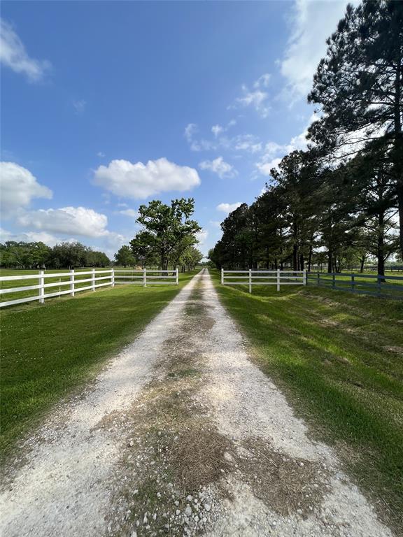 Welcome Home! Beautiful unrestricted Ranch style home on approximately 10.3371 acres! Located in Desirable Friendswood, Texas. 30 x 50 Building, guesthouse and 3-Car Detached Garage with workshop. Circle Drive with Porte-Cochere. Plenty of parking for RV's, get togethers, holiday & BBQ's. ,Home features built-ins and large closets. Kitchen is a cook's dream with cabinets galore and open to breakfast area and family room for entertaining.
NO MUD! NO HOA! AG exempt! Bring your horses! Look at room sizes, all large! Bring your Best offer to be considered!