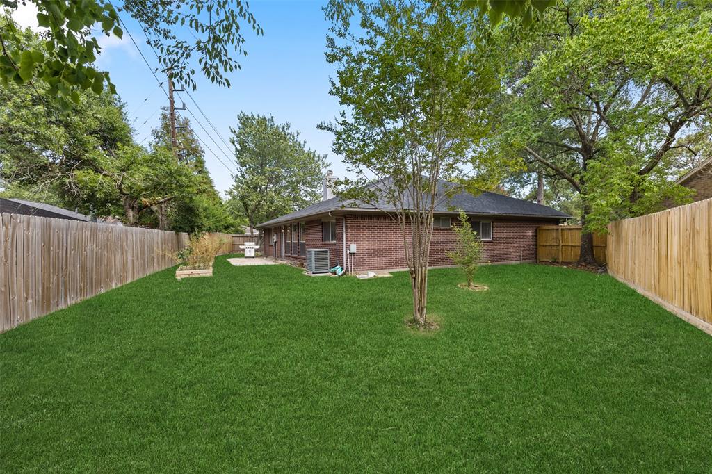 The backyard has a lot of space for a pool and playscape.