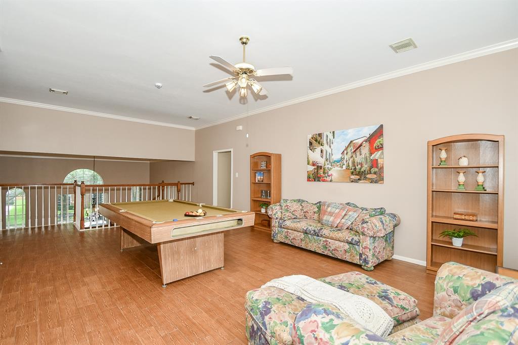 What an exciting view, from gameroom and railing overlooking the living/family space, below.