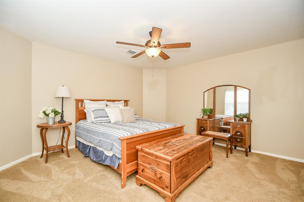 Another secondary, carpeted bedroom offers great space.