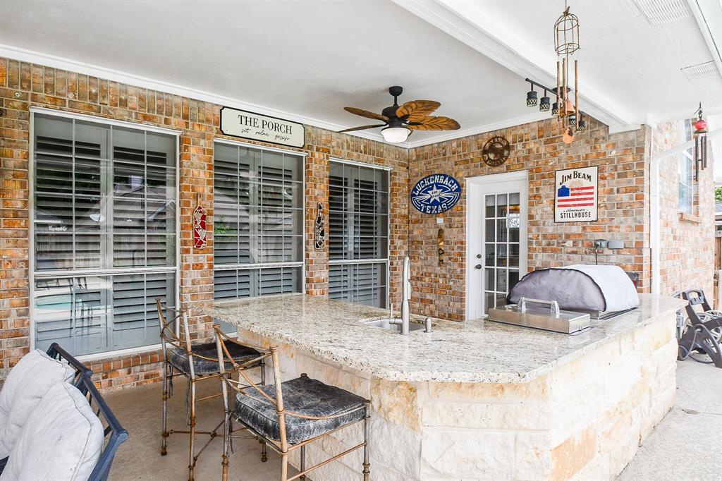 Keep reminding yourself that this is all yours and not a feature of a lush resort! Your fully equipped outdoor kitchen features this beautiful bar . . . while you wait for a magnificent meal!
