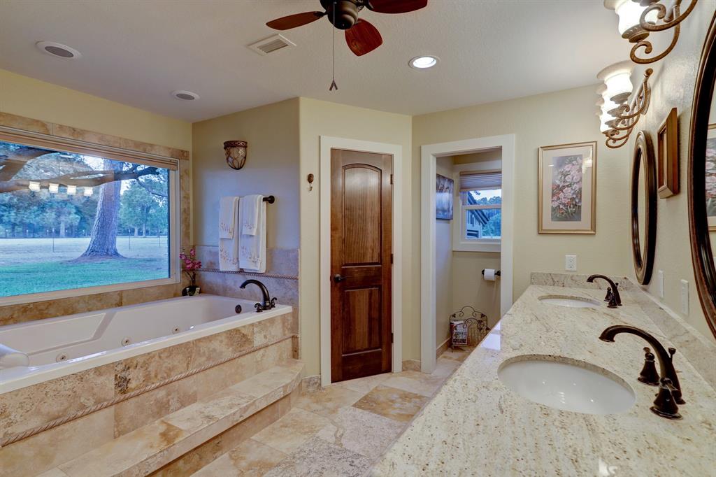 There are double walk-in cedar lined closets, a large separate shower and beautiful attention to detail in master bath. Note the wonderful view!