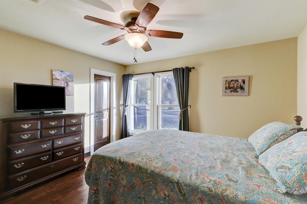 View of one of the 2 bedrooms located in a private suite off of the main living area. The door leads to large walk-in closet.
