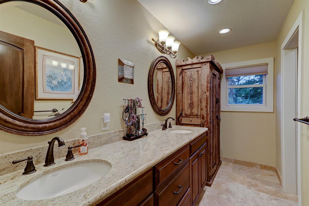 This secondary bathroom is located within the private suite off of the main living area. It offers a large walk-in shower and great storage.