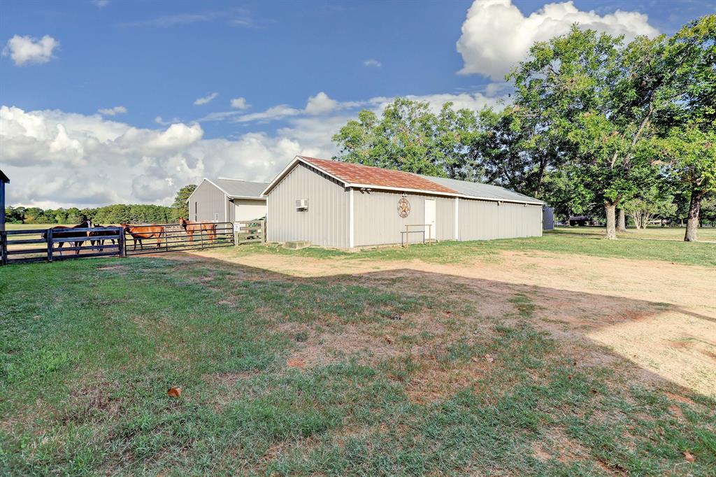 This third auxiliary building was partly the original ranch building. It was added onto to become storage with bay door access. It offers an air conditioned bunkhouse and room for living or extra storage. The building located next to it is the shop.