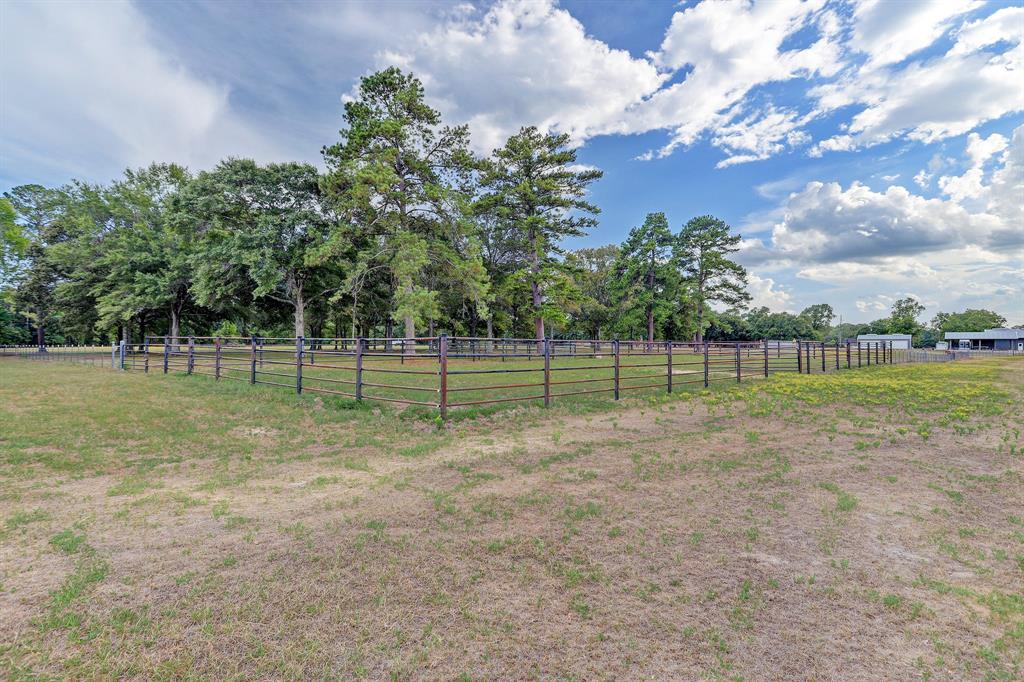 There are additional turn out pens with loafing sheds and an arena. This view is looking towards the barns with the pavilion in the foreground.