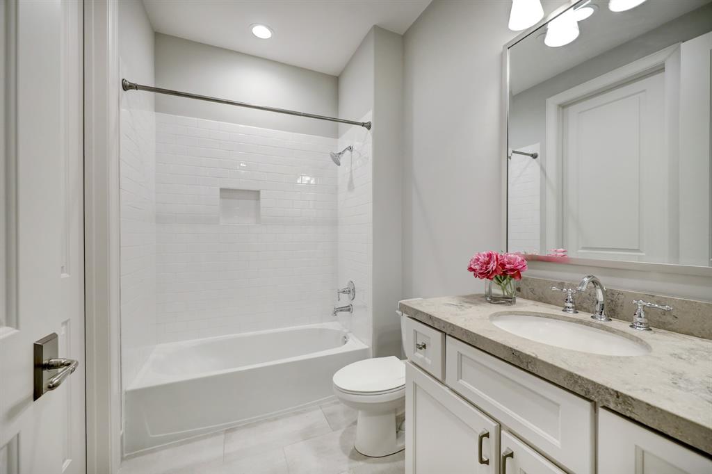 Fourth level bath connects to the bedroom but also has a door to the hall for guests in the gameroom.
