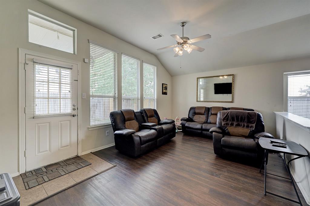 The back door conveniently provides access to a patio and the oversized and fenced back yard.
