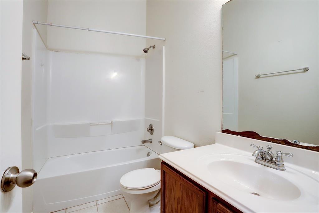 The bath shared by the secondary bedrooms includes a shower/tub combo.