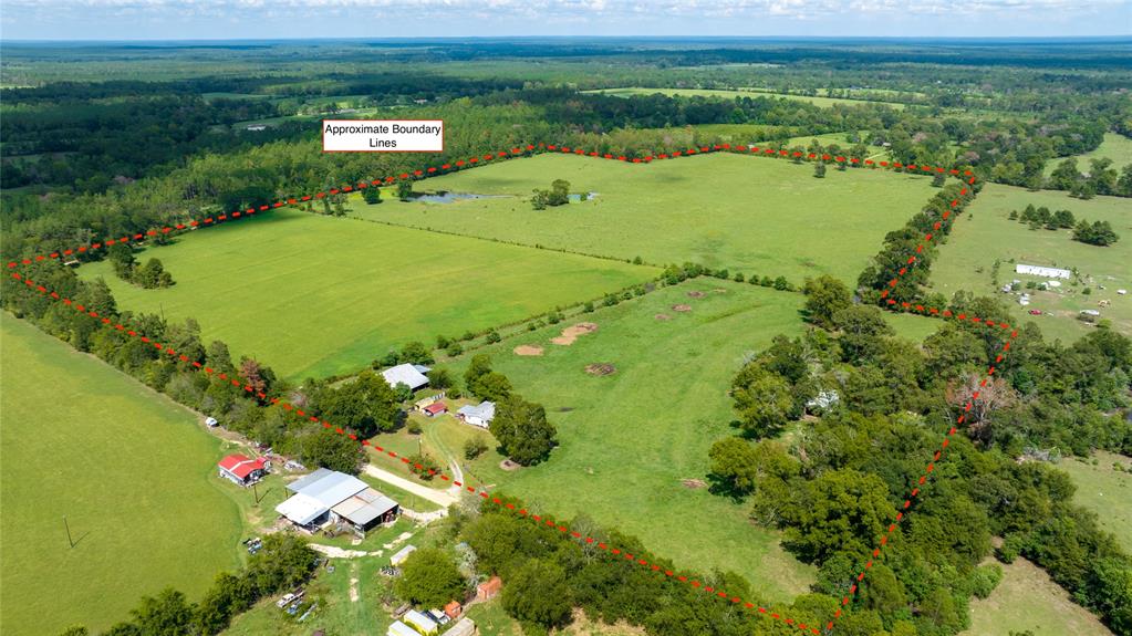 Centralia, Trinity County, Texas 66+/- acre ranch property. Currently an ag exempt, cow-calf operation supporting 47 head, with cross fenced pastures, several year round ponds and a 15 acre, producing hay meadow. 40x50 main barn, working pens and chutes, 20x40 hay barn and a small, 2 bedroom 1 bath farmhouse. This property has over a half mile of road frontage from two county roads for several potential home sites. Water provided by rural water supply line. Close to amenaties in Apple Springs but nearby Davy Crockett National Forest and several neighboring large tracts make this property very private and peaceful.
