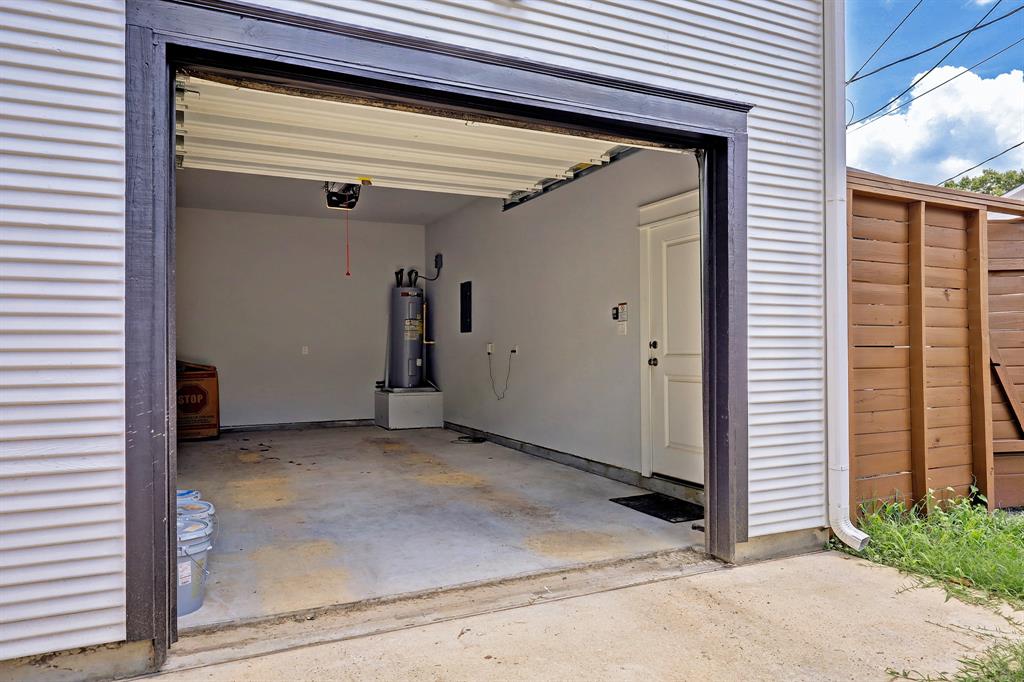 Unique private garage provides secure parking and private entrance through alley access.