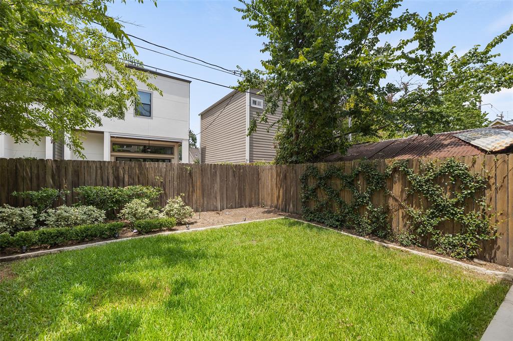Despite the size of the patio, you still have a lot of greenspace in the backyard. This generous yard is a great space to let the dogs or kids run around. The backyard has been professionally landscaped.
