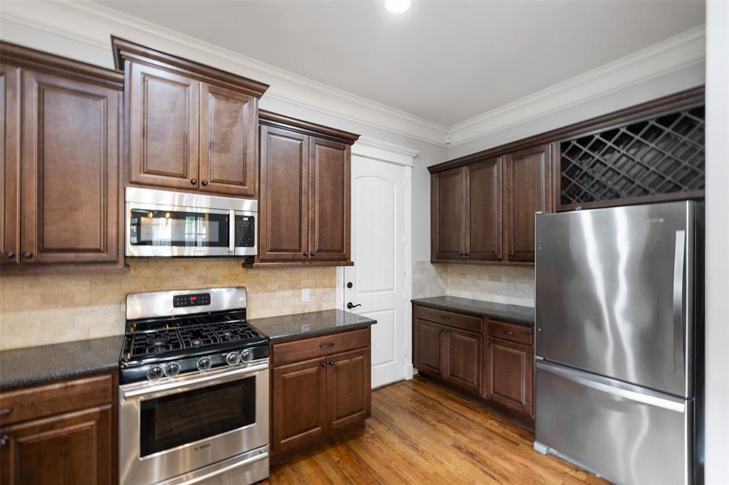 The kitchen also includes granite countertops and stainless steel appliances.