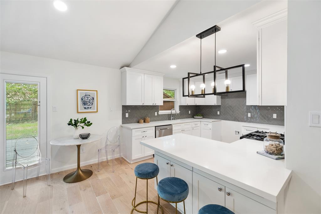 The family chef will love the updated kitchen that features new cabinets, quartz counter tops and stainless steel appliances.