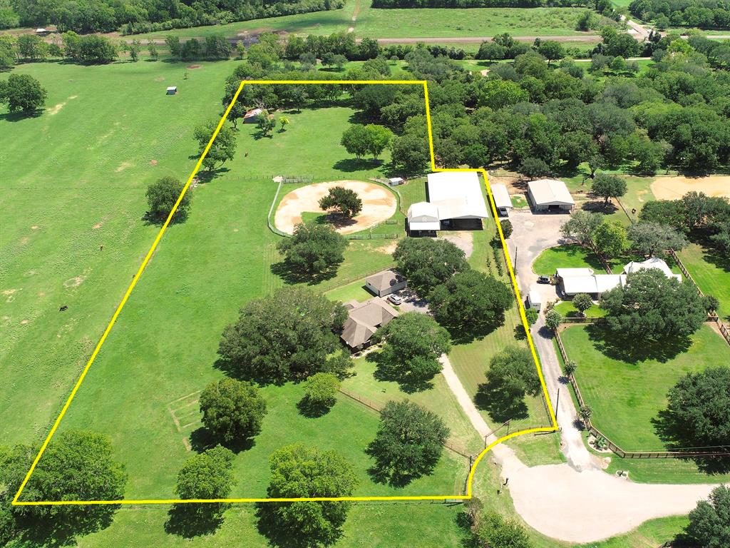 This is one of few Gentlemen Ranches in west Houston, perfect for HORSES & grazing CATTLE. Located at the end of a quiet cul-de-sac and behind private gates on 6-beautiful Acres. Offers a built-out 3-stall Barn with tack room and washing station, turn-outs into Riding Arena. Additional paddock and Stable. It is fenced, crossed fenced and includes a hen house. LOADS of mature trees. This red brick home captures the essence of fine Texas living with century old trees and sprawling green pastures. Inside is comfortably finished with a mix of wood, tile, and carpet, custom cabinetry, granite counters, and warm paint colors. Wood burning fireplace in Family Room, double doors lead to covered back Porch. Butcher block center Kitchen Island, 5-burner gas stove with custom vent hood, built-in microwave and wine storage. Large Primary Suite. Secondary Bedrooms are secluded, and oversized. Huge Flex room. Covered back Porch and extended wood deck with pergola. AG-EXEMPT. LOW TAXES!