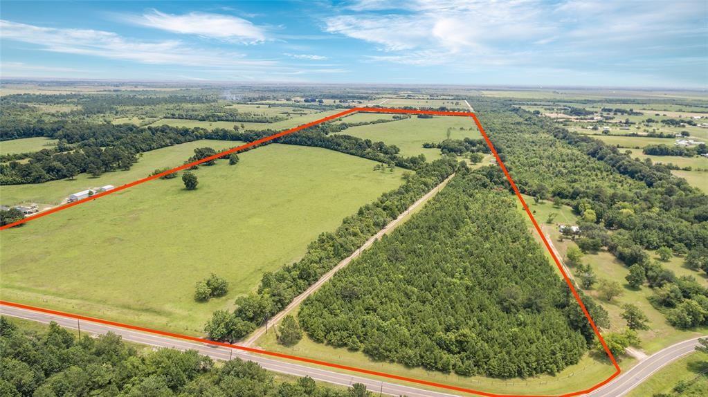 You’ll love this gorgeous 123 +/-acres, priced at $14+ per acre!! The site of an old family farm, this property has endless possibilities.  Beautiful live oaks and other trees strategically planted. Small creek also winds thought the property. Fenced and cross fenced. 65x105 Barn provides great storage.  Additional storage building on property. Water available through Trinity Bay Conservation District.  Pictures don’t show the true beauty of this property.  The homesite did not flood during Harvey.  Call today to call this ranch yours!!