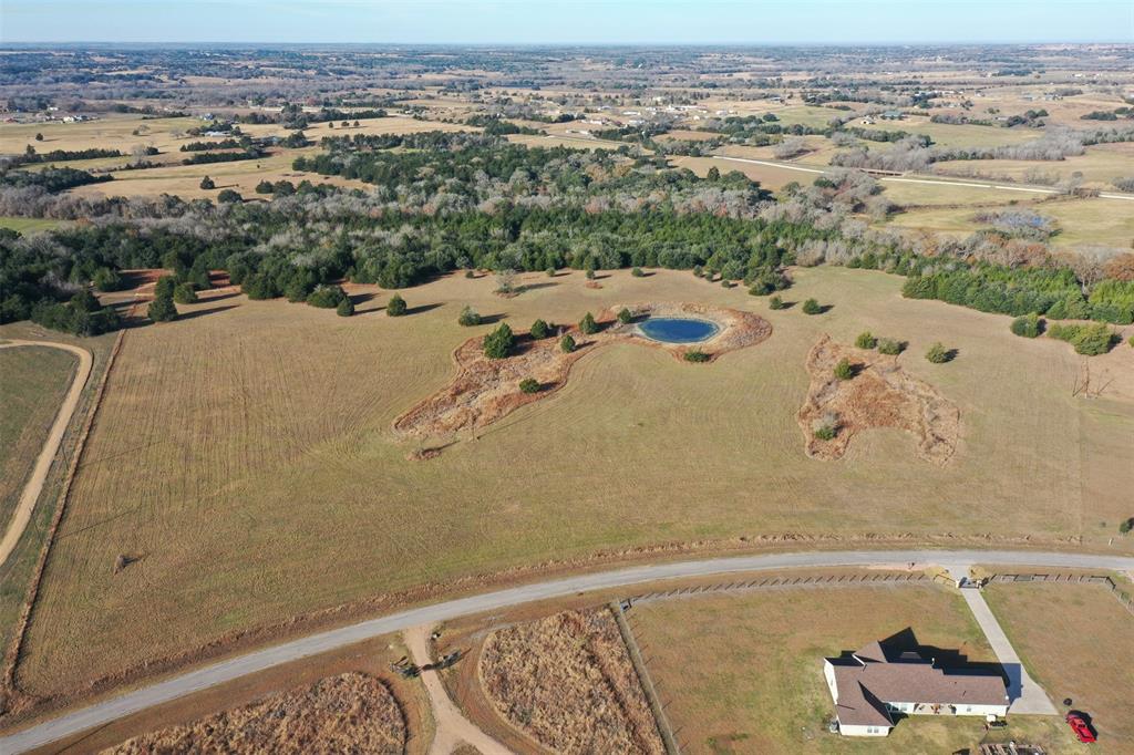 Just over 32 acres of rolling terrain ideally situated between Brenham and Round Top, near the small town of Latium. Great homesite with clusters of trees, woods, open meadows, pond, nice countryside views, paved road frontage and light restrictions. Electricity is available.