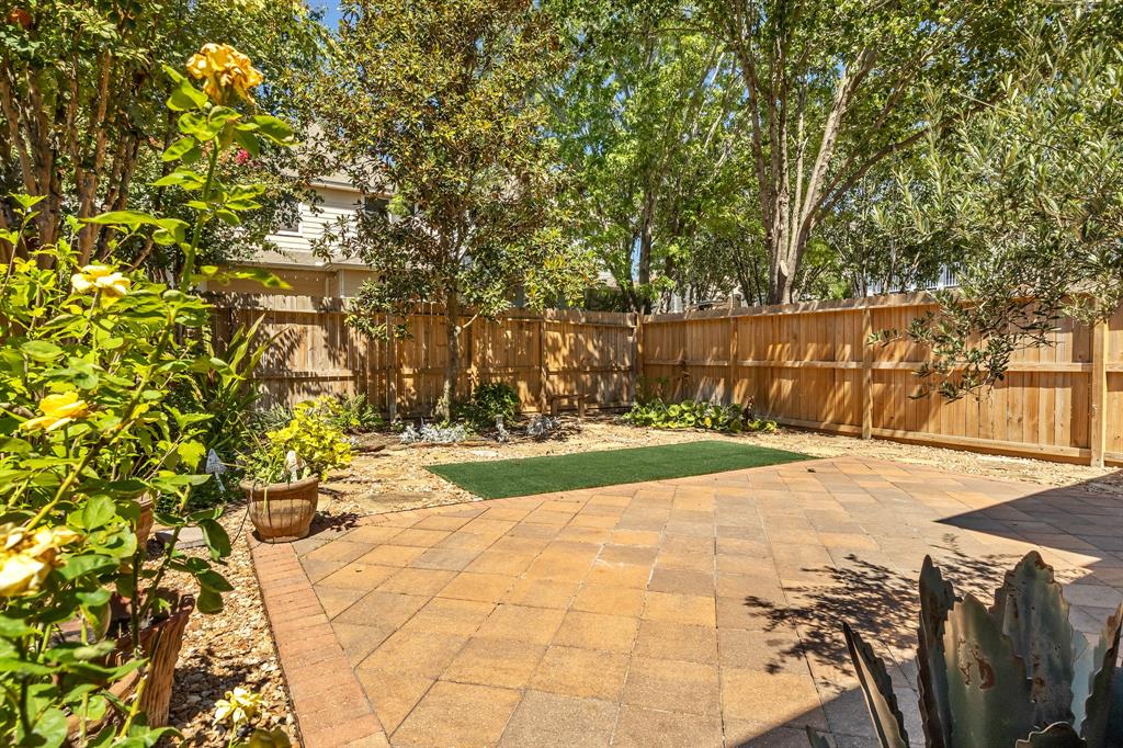 Ample space in this backyard makes for a great space to host barbecues or just relax with your kids or pets.