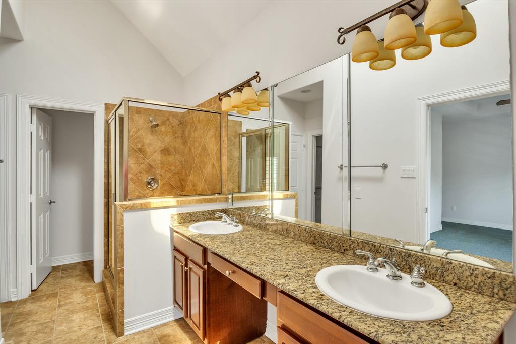 Double sinks and a separate shower in the Primary Bathroom.