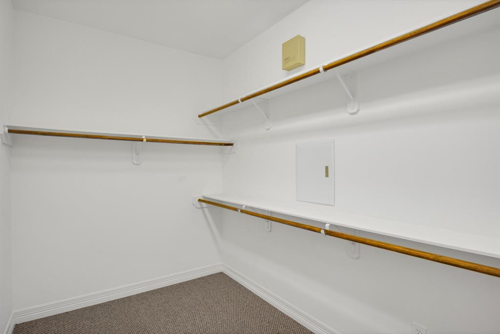 The large walk in closet in this primary suite has ample space.