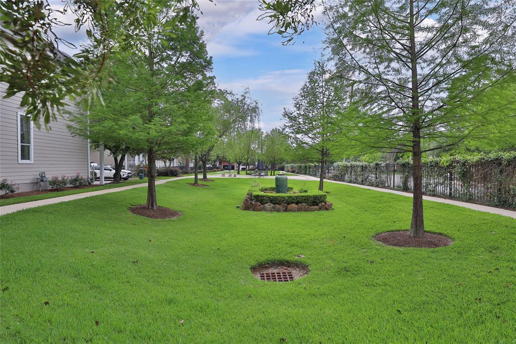 This neighborhood is unique in that there is a large green space and walking trail for residents to use.