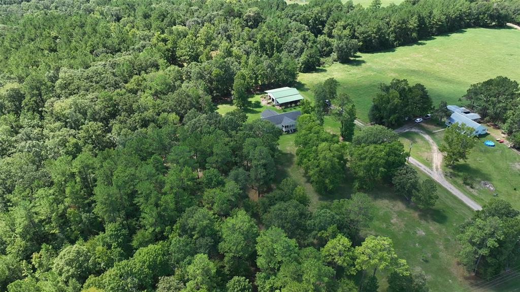 Get away from the city life and get out into the country with this 42 acre country homesite located 2 hours outside of Houston. This tract offers the turn-key country living experience with plenty of room to roam. Subject property has all the modern comforts and amenities while maintaining that sense of seclusion and privacy. Fire up the ATVs, put on the hiking boots, and grab the fishing poles..this tract has it all. A rare find in today's market. Book your appointment today!