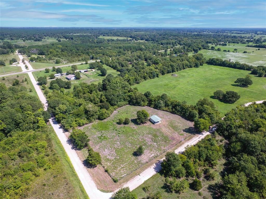 Nearly 4 acres nestled off scenic FM 2445. Tucked in and screened by natural landscape, the property offers a serene setting while being minutes from Hwy 105 and the new 249 expressway. Quaint barn, insulated and stubbed out for plumbing, provides space for storage or a place to build out for weekend use. Unrestricted and partially fenced with pipe fencing. Midsouth power and internet nearby. Septic and water well needed.