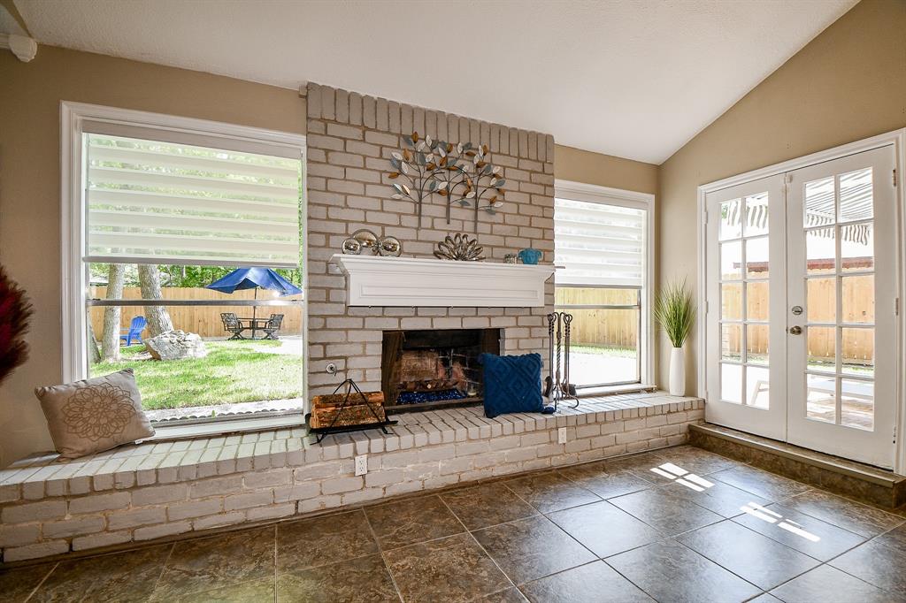 In any season and in any weather, this gorgeous fireplace and brick window seat warms spirits, while offering a comfy spot to appreciate the view of the patio and lush backyard.