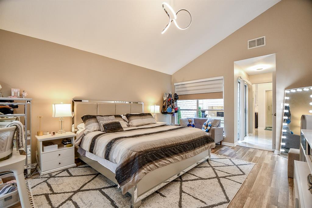 Here's your primary suite; your private place of peace and repose, with high ceiling, incredible wall and floor space, and a mid-wall double window for pure natural light and easy lifting