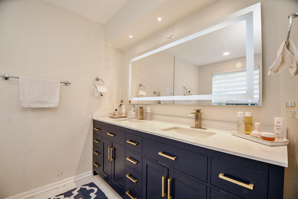 The stunning color contrast (light/dark) of luxury bath appointments, fill your primary ensuite bath.