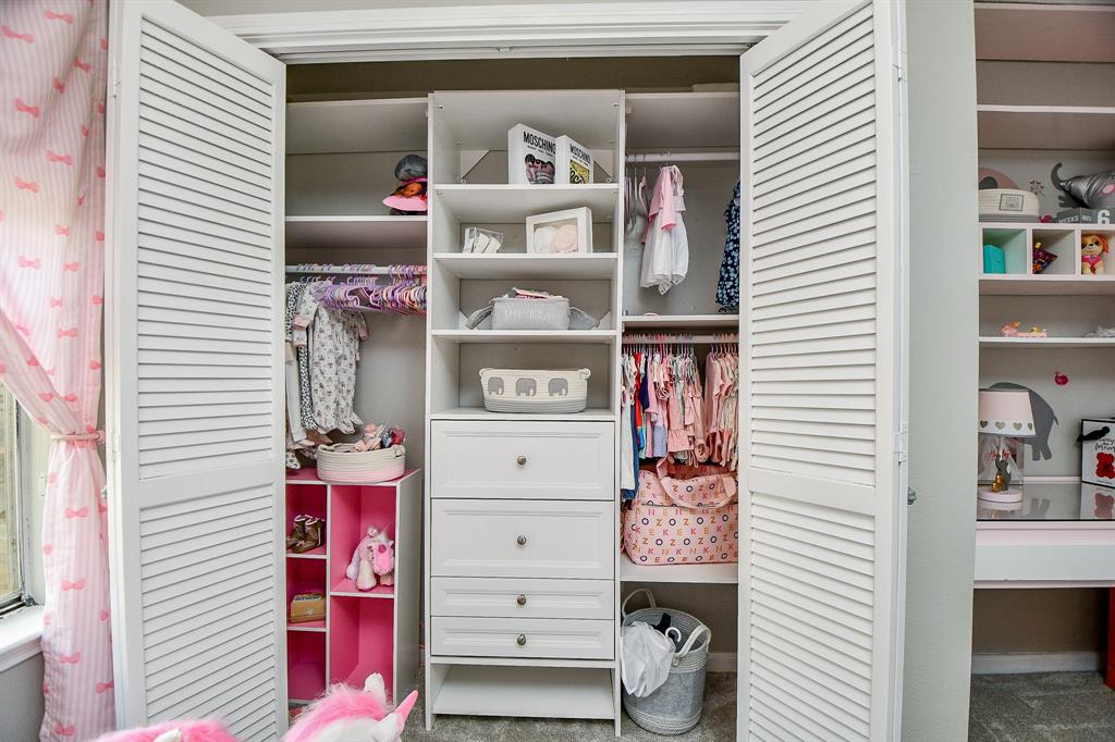 Just look at the amazing built-in closet storage in this large secondary bedroom!