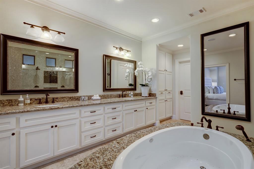 Another feature of this luxurious bath is the TV inside the mirror.