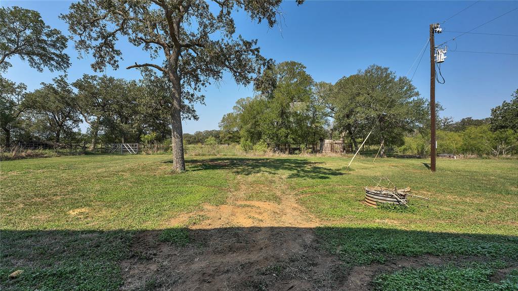 Want to move to the Country? Look no further!! Check out this 35.74 Acre property in Leesville, TX! (Halfway between Seguin, TX & Gonzales,TX) Wait until you see the GIANT 3375 SqFt Barn/Shop, with a 40x20 Awning that already has full electric going to it!! The possibilities are endless! There is a Livable 3/2 Manufactured on the property as well, that you could live in, while building out your Barndo. 34.74 acres is Fenced on all 4 sides w/ a gate, and has a stock tank. Lots of Huge, Mature Oaks and other trees on property! NO RESTRICTIONS!! Country Living is waiting for you!!