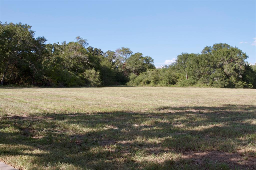 FABULOUS LOCATION! 9+ acres of unrestricted land with mature specimen pecans and oaks at the corner of SH 36 and Koy Road. Just 2.6 miles from historic Bellville town square and all of its amenities. Ideal for a business. Main home is tucked-off Koy Road enough for private county living. One story ranch-style home with 3 bedrooms, 3 full bathrooms, open concept living/dining and sun room. Spacious kitchen with eat-in space. Large craft room with custom cabinetry could be a 4th bedroom. 2012 bardominium with large living space, one bedroom, full bathroom, laundry room, custom storage cabinets, screened porch and huge garage ideal for RV or boat storage and decked attic. Storage barn with open space for tractor/four wheelers and workshop. Property is being sold in "As-Is" condition. BRING YOUR TASTES AND MAKE THIS HOME YOUR STYLE.