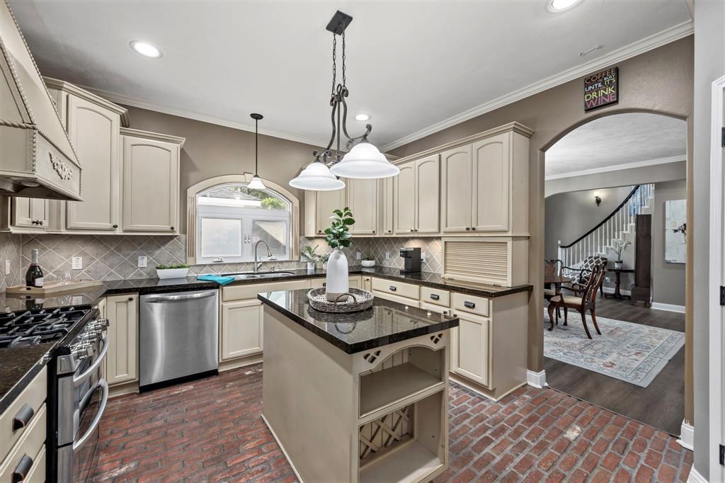 With both upper and lower wrap-around cabinetry, plus a large center island with storage and generous corner pantry, you will never run out of storage or prep space in this dream kitchen!
