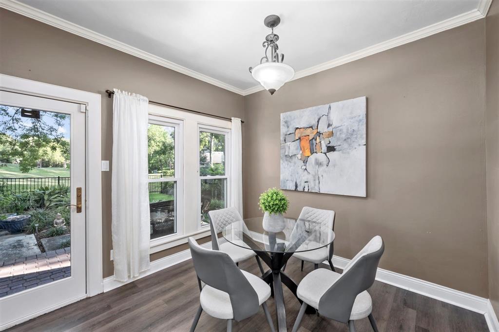 Enjoy your morning coffee and intimate family dinners in this light and bright breakfast space, with a glass pane door that opens to a wonderful covered patio and lush backyard.