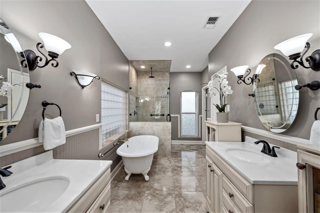 Skip the spa and retreat to your dazzling en-suite bathroom, boasting gleaming tile floors, and dual sink vanities with gorgeous designer fixtures.