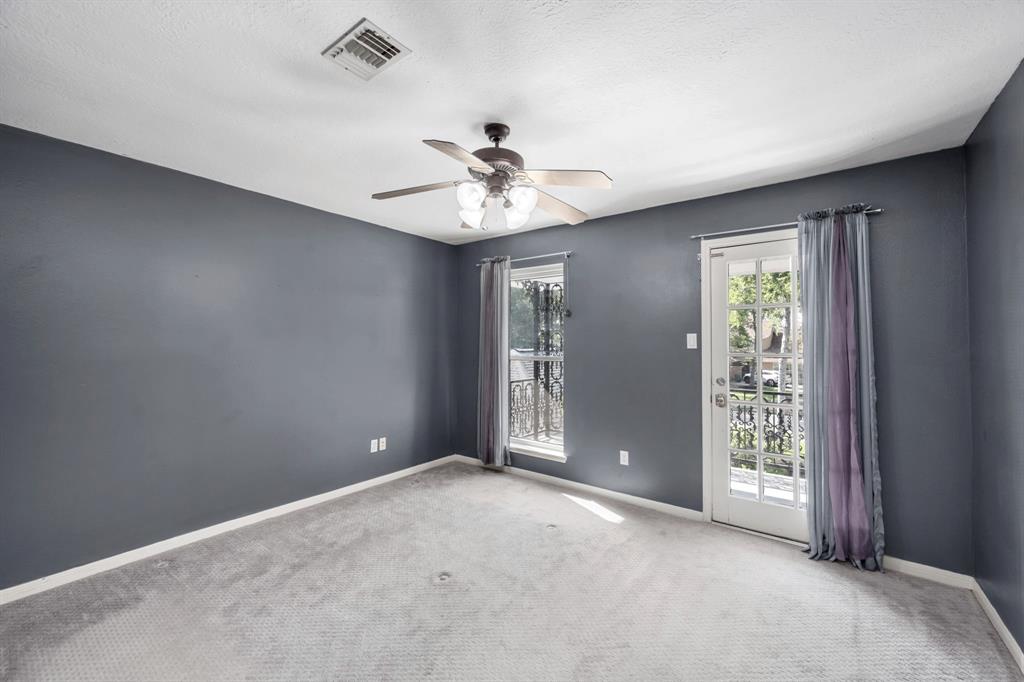 The third bedroom is equally as beautiful, also with direct access to the Jack & Jill bathroom. The glass pane door opens to an impressive balcony with street views.