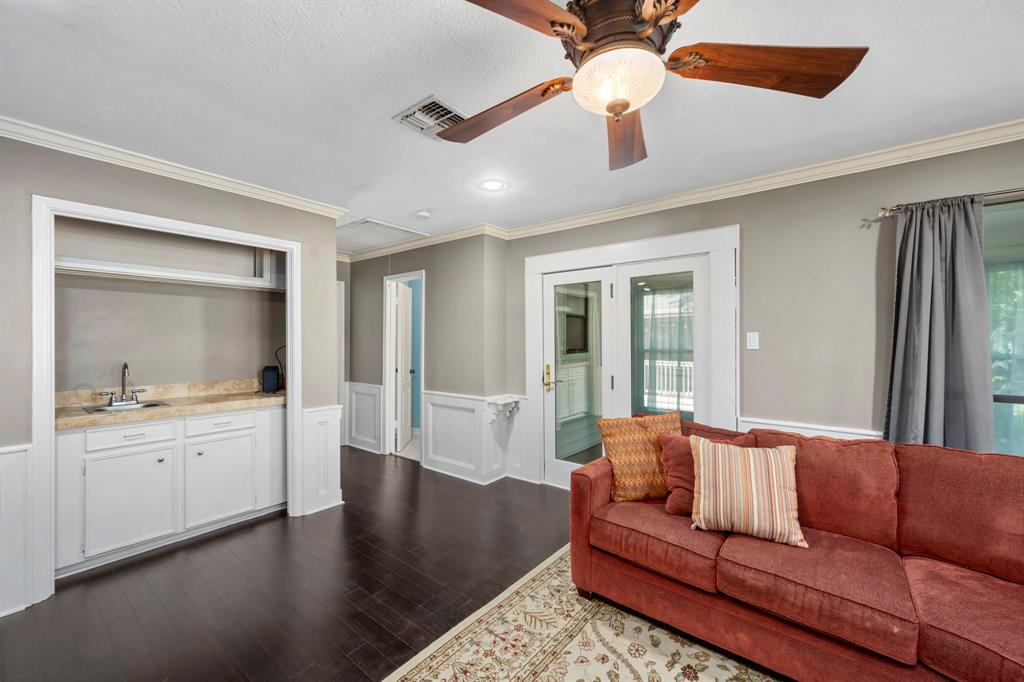 The upstairs game room also features a lovely wet bar with a sink for entertaining. Imagine the game nights you can host here!