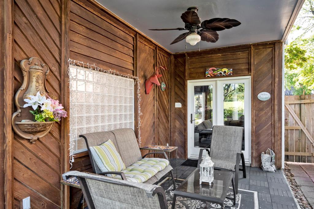 Find yet another covered patio outside of the Primary bedroom, also with a lit ceiling fan. This home truly as it all!