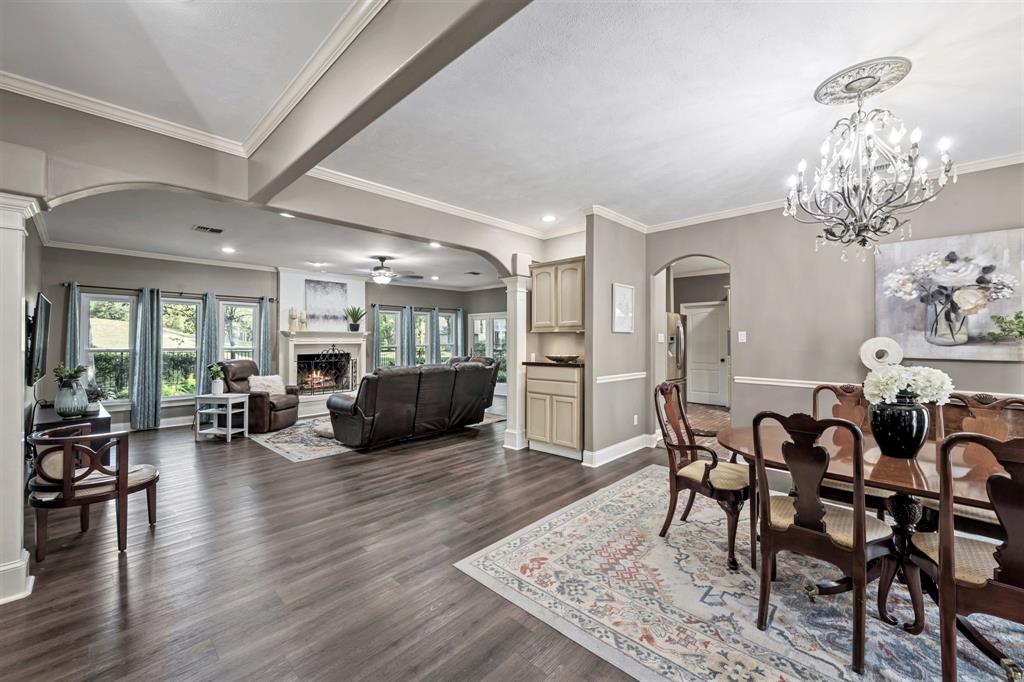 Take note of the crown molding, designer paint, and vinyl plank floors that carry across the foyer and main living spaces. No expense was spared to make this home gorgeous from the very moment you step inside.