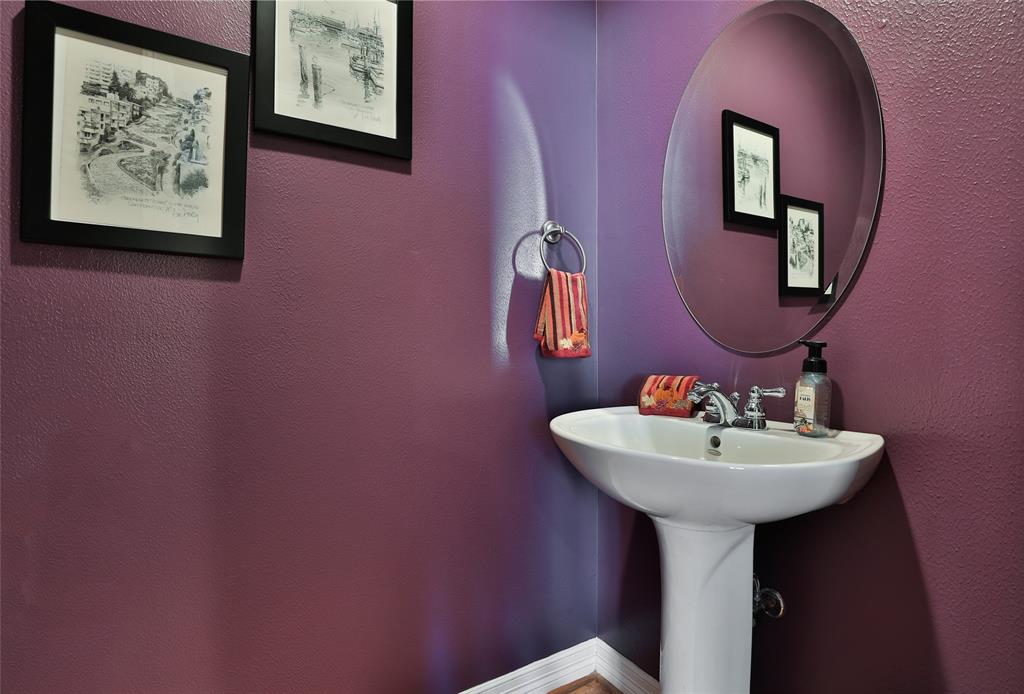 Cute pop of color in the downstairs half bath.