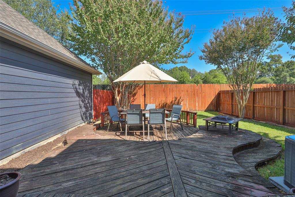 The home features a large deck just off the dining room, perfect for  for entertaining.