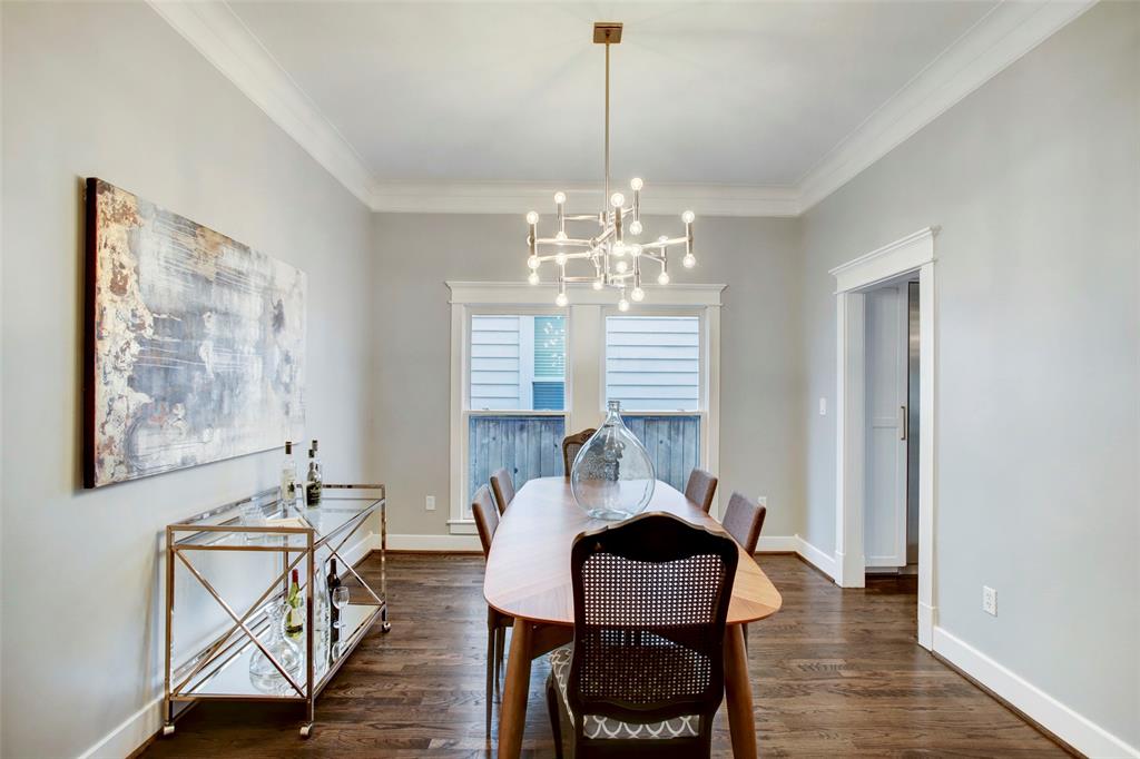 Graciously appointed dining area just off the kitchen allows for easy entertaining