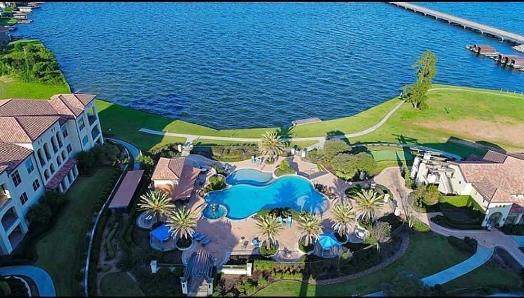 Beautiful waterfront unit with wide lake views to Lake Conroe. 3 bedrooms, 2 baths, 10' ceilings, tile floors, granite countertops, soaking tub, spacious storage closets & balcony. The unit overlooks the Cabana Club which includes the Billiards Room, Athletic Facility, large entertainment room, Infinity pool, hot tub, Pavilion w/ Barbeque Area, Roof-top Deck, Outdoor fireside living area & lakeside porch. Elevator access to unit. Come check it out!!