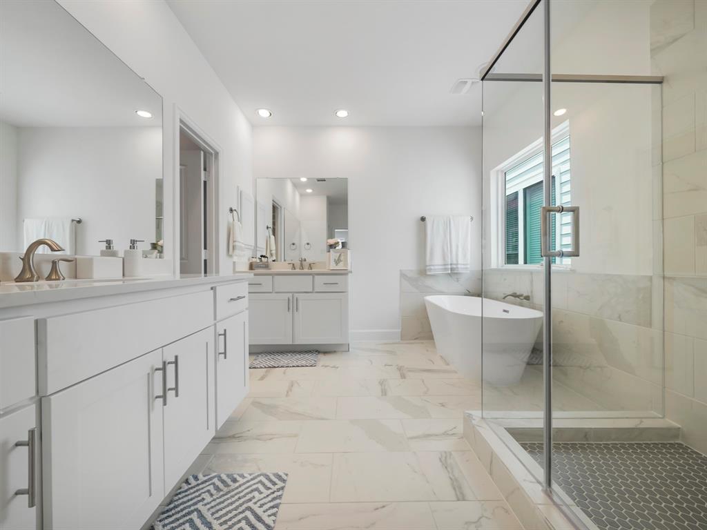 The Primary Bath is highlighted by the spacious shower and the separate soaking tub. Enjoy a nice bubble bath after a long day!