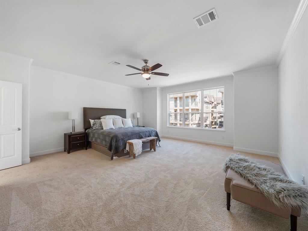 The Primary Bedroom, which features an abundance of light, and is extremely spacious. The bedroom comfortably fits a king-sized bed and still allows plenty of room to play with.